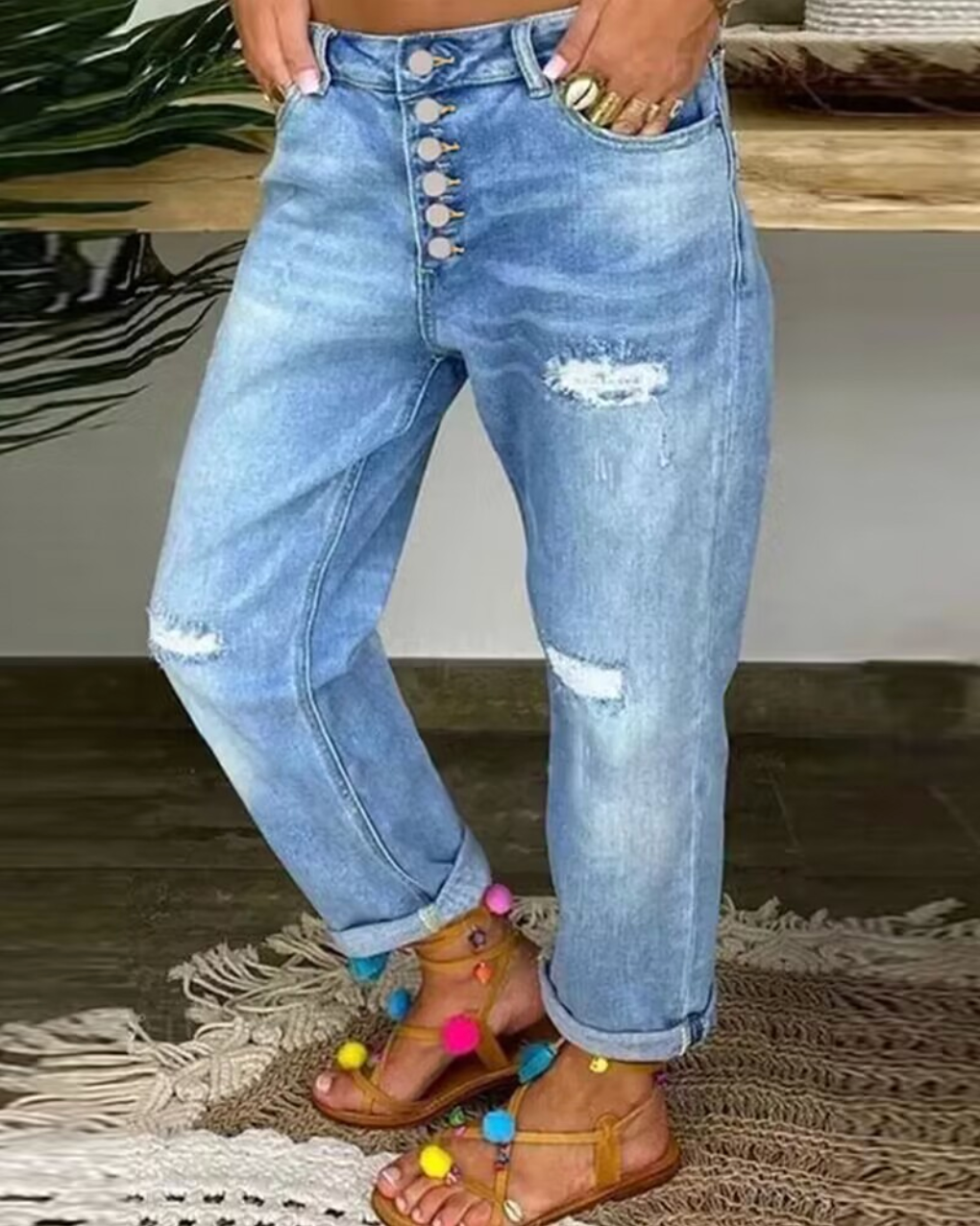 Women’s Denim Jeans with Rips and Button Closure